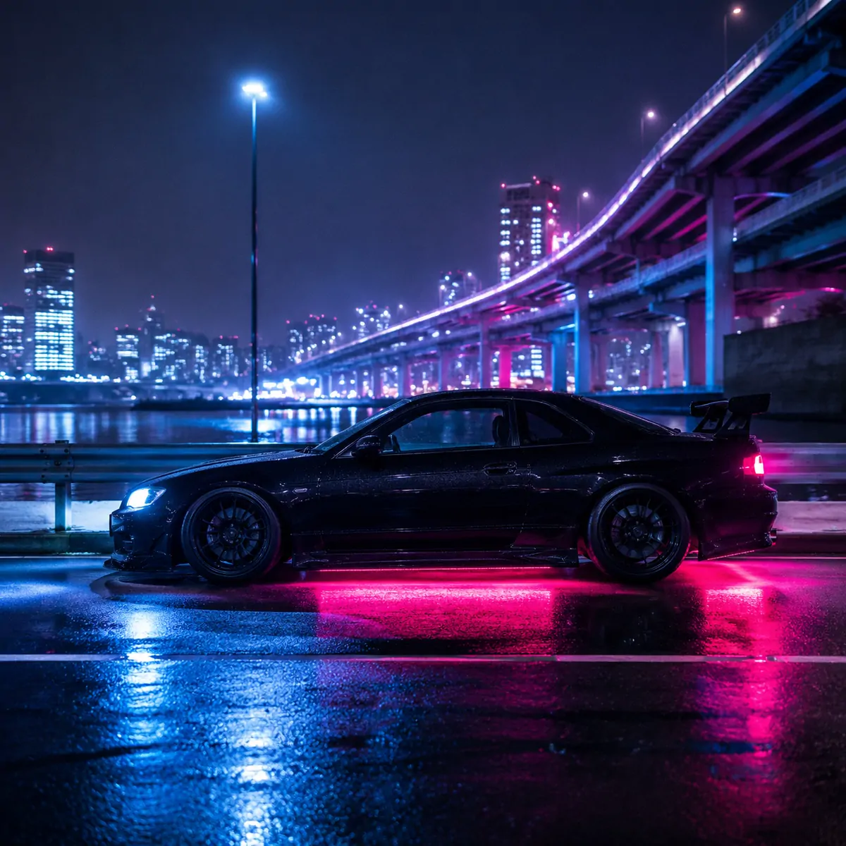 Sports car under a neon-lit city highway at night