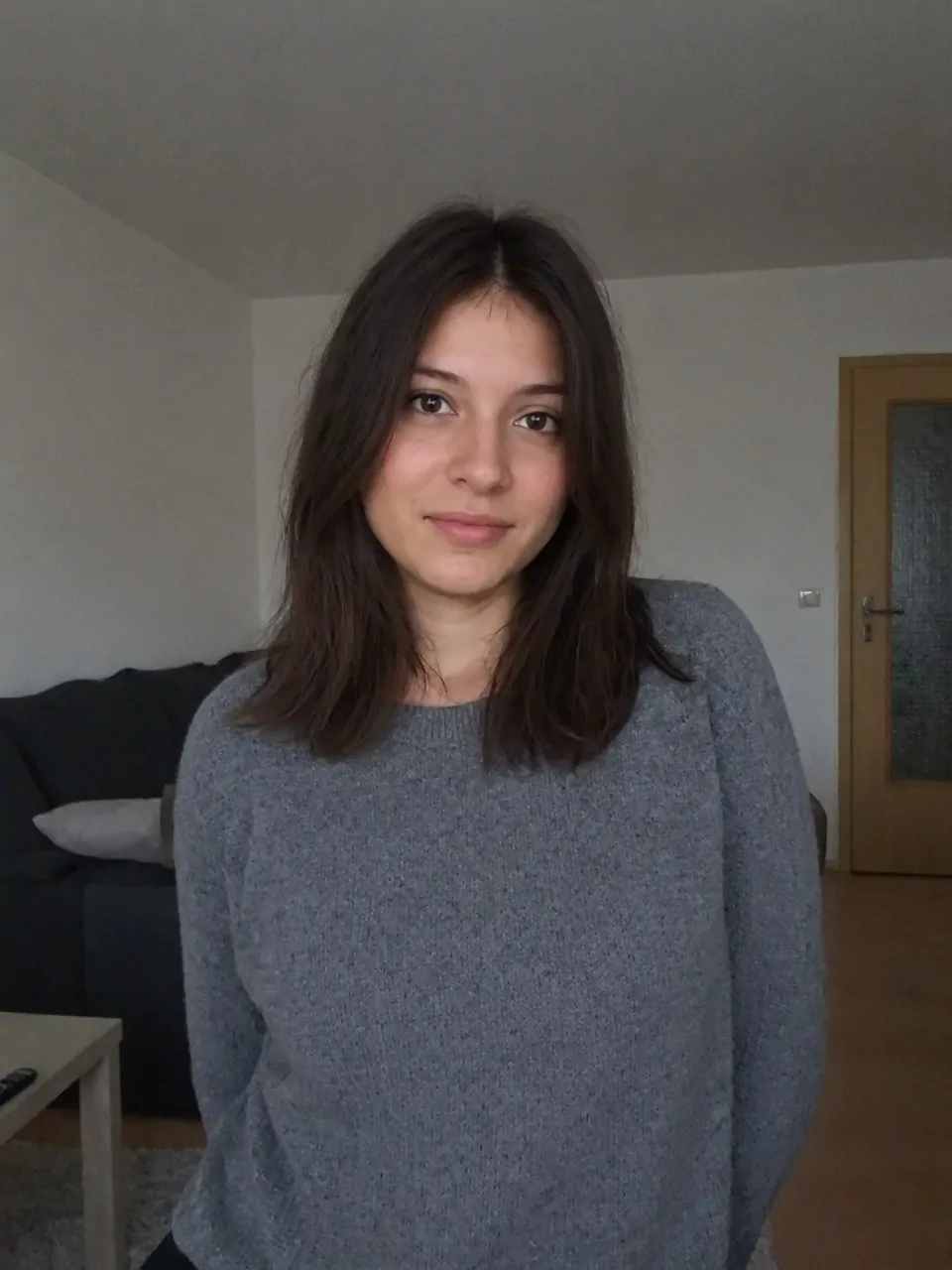 Original casual phone photo of a woman indoors